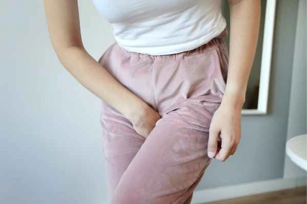older woman running to the toilet because of urinary incontinence Greater London (Hounslow)